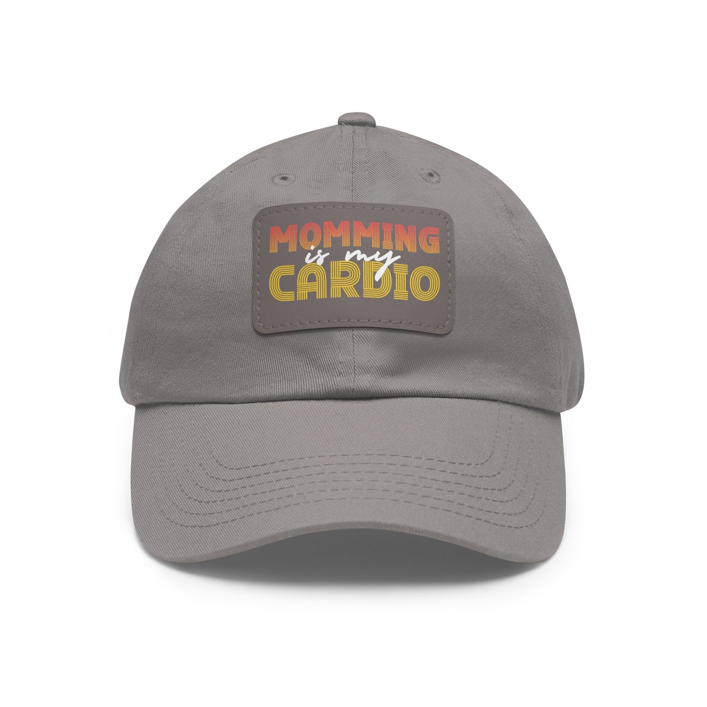 A gray "Momming Is My Cardio" hat featuring a colorful patch with the phrase in uppercase letters.