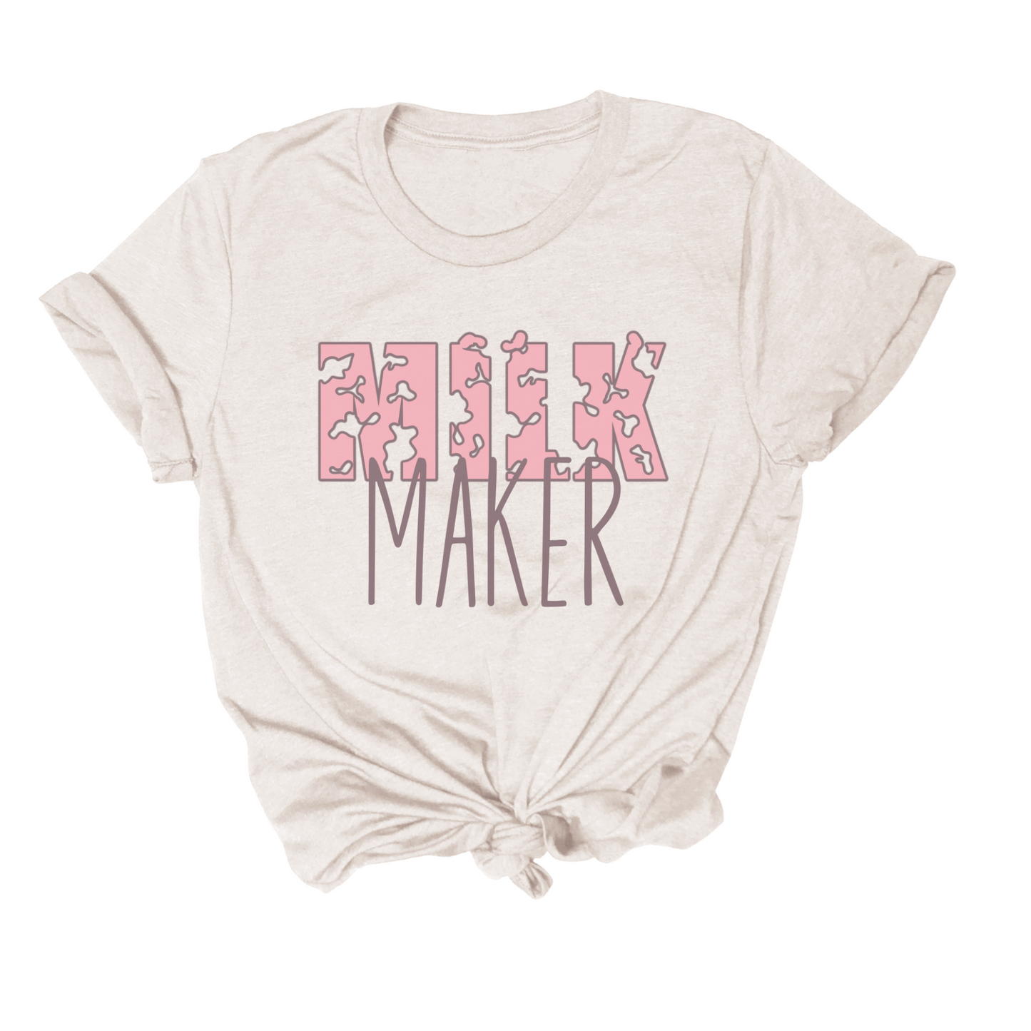 A natural "Milk Maker" Breastfeeding Tee with "MilK MAKER" written in pink and brown text, featuring a knotted hem at the bottom. This classic unisex jersey tee is made from 100% combed and ring-spun cotton, offering one of the softest tees you'll ever wear.