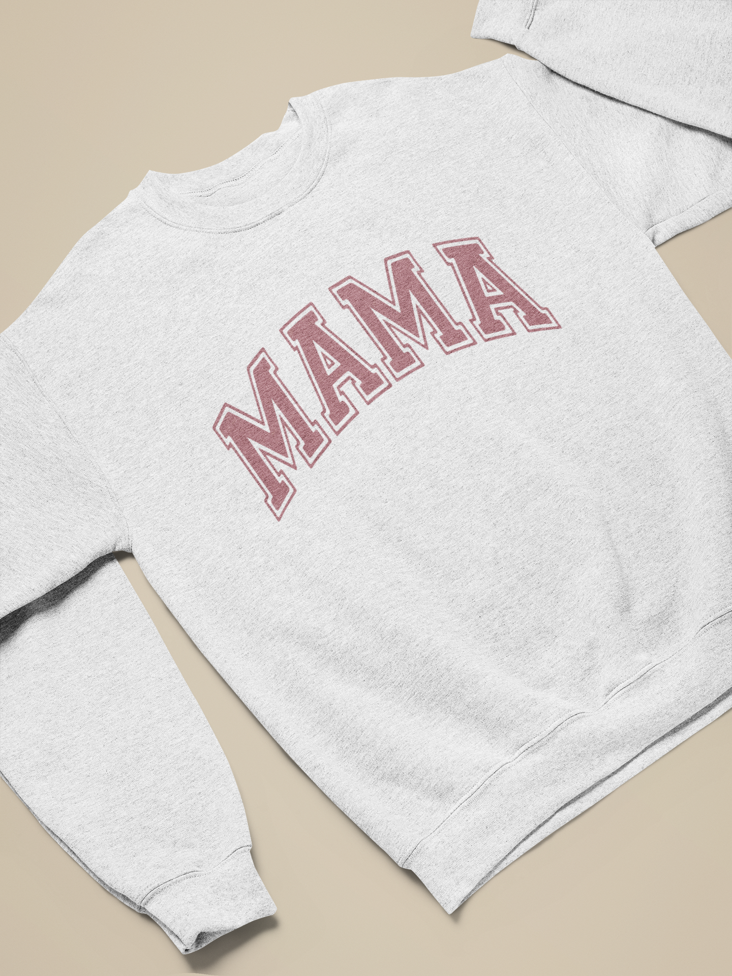 MAMA Sweatshirt in gray with bold red block letters, showcased on a beige background.