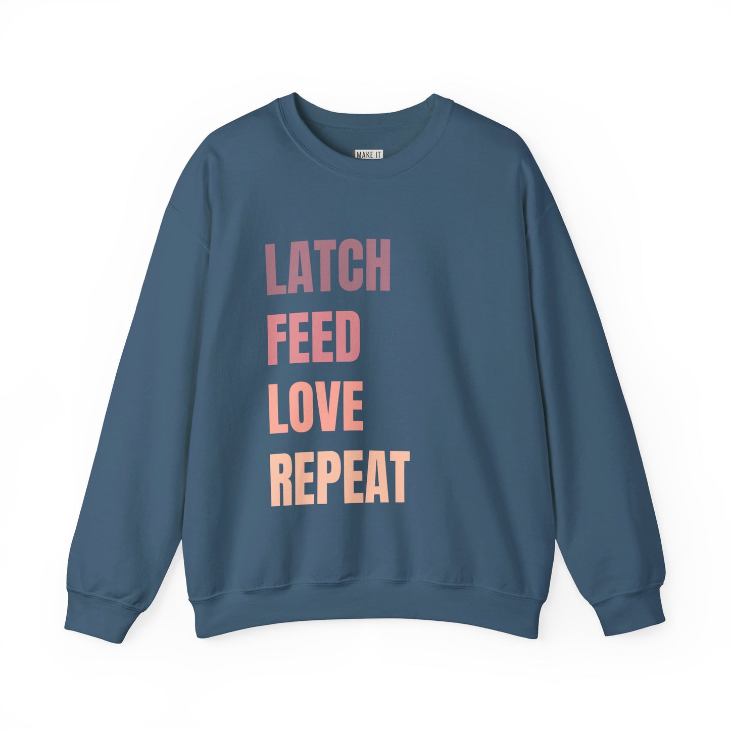 Denim blue breastfeeding sweatshirt that says LATCH FEED LOVE REPEAT in bold pink gradient font.