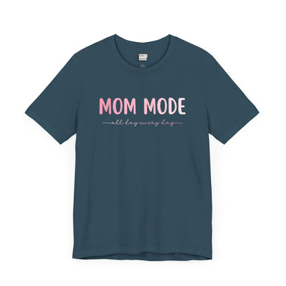 Deep teal-colored mom t-shirt with the text MOM MODE all day every day in pink and white font.