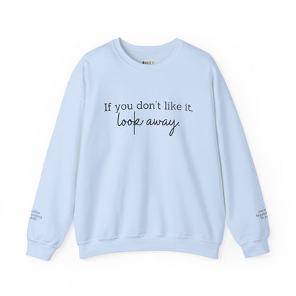 Light blue breastfeeding sweatshirt with IF YOU DON'T LIKE IT, LOOK AWAY printed on front and normalize breastfeeding in public printed on sleeves by the wrist.