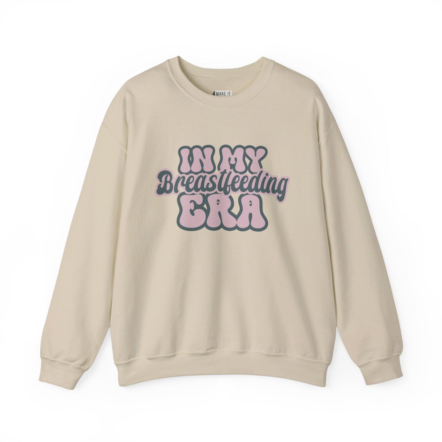 Sand colored breastfeeding sweatshirt that says IN MY BREASTFEEDING ERA in pink and blue retro lettering.