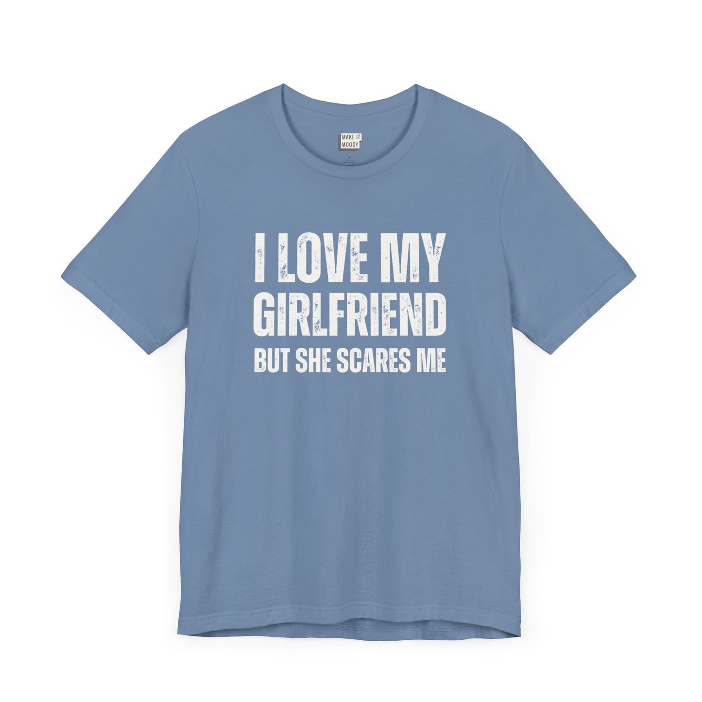 funny boyfriend shirt in light blue that says I LOVE MY GIRLFRIEND BUT SHE SCARES ME in bold white lettering