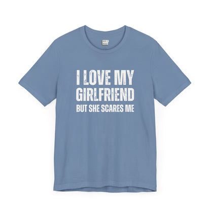 funny boyfriend shirt in light blue that says I LOVE MY GIRLFRIEND BUT SHE SCARES ME in bold white lettering