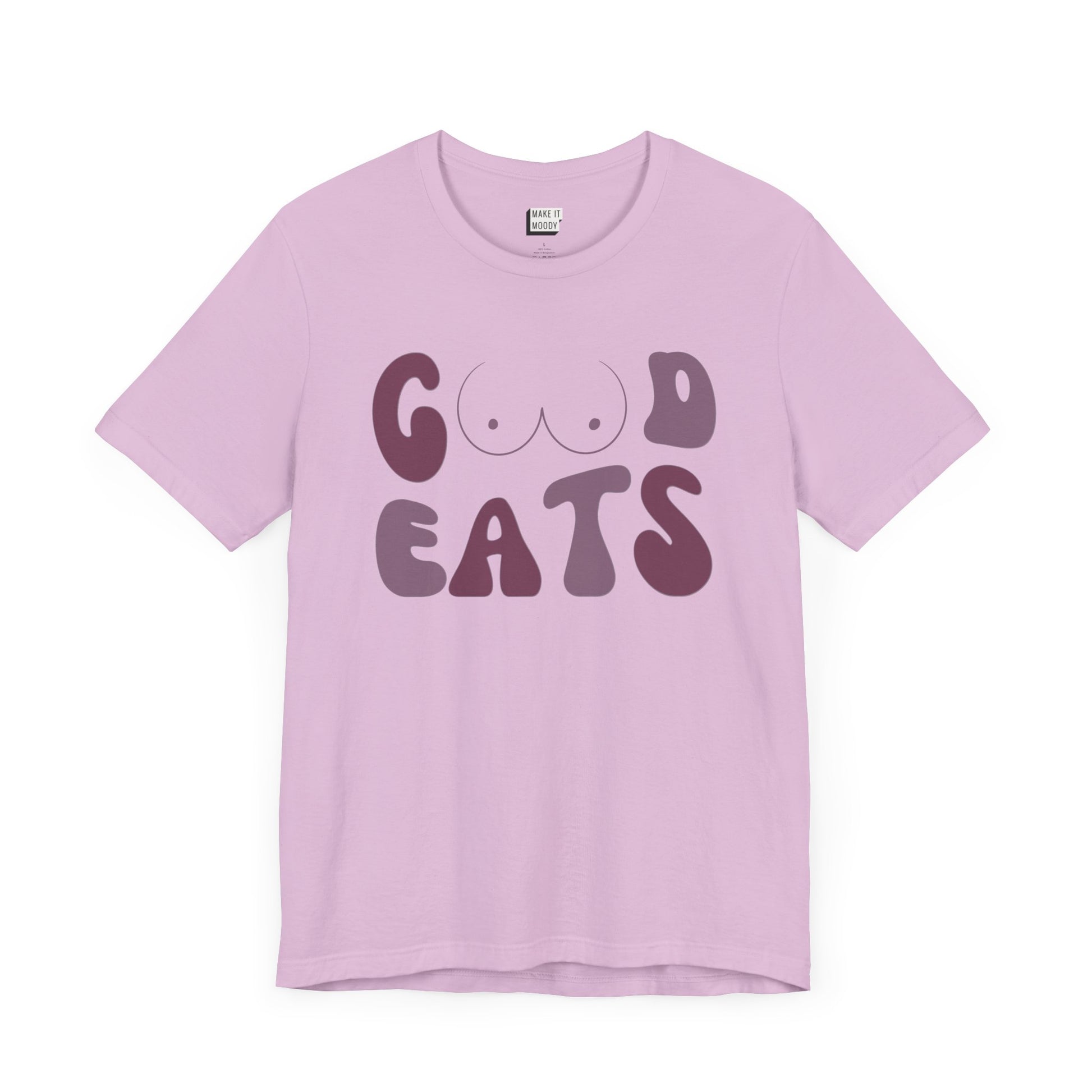 Lilac purple retro-style breastfeeding t-shirt that says GOOD EATS on the front with a minimalistic breast graphic in place of the double O in the word GOOD.