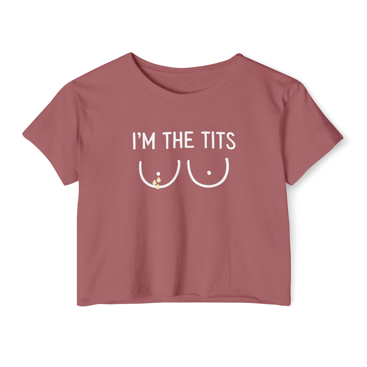 A smoked paprika Cropped Tee featuring the text I'M THE TITS and a minimalist drawing of two breasts in white beneath the text, making it a perfect funny breastfeeding shirt.