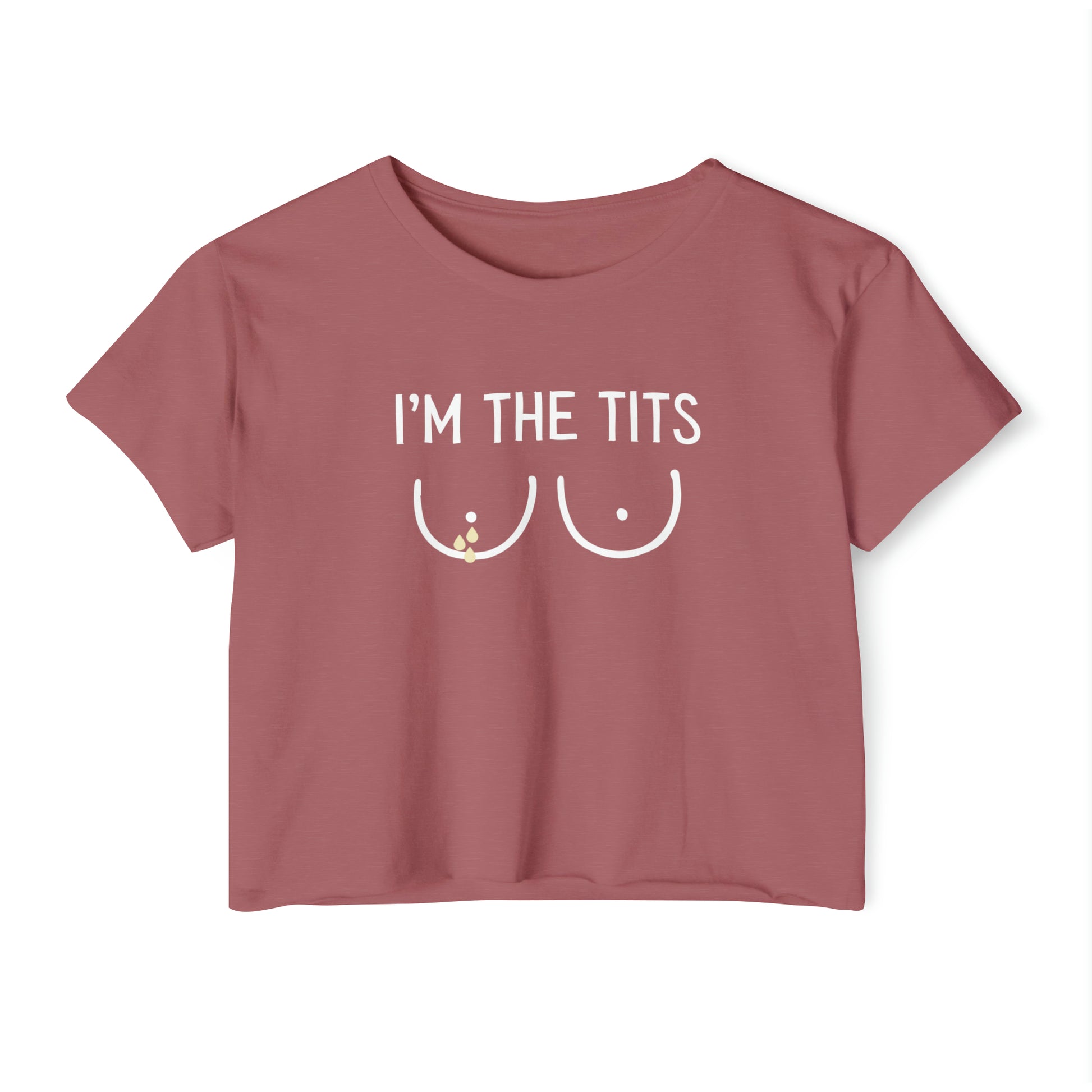 A smoked paprika Cropped Tee featuring the text I'M THE TITS and a minimalist drawing of two breasts in white beneath the text, making it a perfect funny breastfeeding shirt.