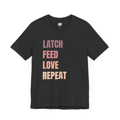 Dark heather grey breastfeeding t-shirt with the words LATCH FEED LOVE REPEAT in bold pink gradient text.