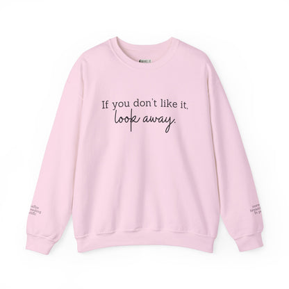 Pink breastfeeding sweatshirt with IF YOU DON'T LIKE IT, LOOK AWAY printed on front and normalize breastfeeding in public printed on sleeves by the wrist.