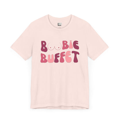 soft pink breastfeeding t-shirt with the words BOOBIE BUFFET printed on the front in pink retro font with a minimalistic breast graphic in place of the double O in the word BOOBIE.

