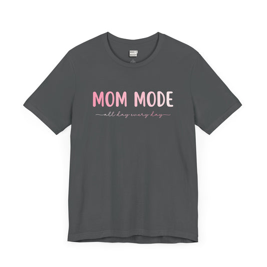 Asphalt-colored mom t-shirt with the text MOM MODE all day every day in pink and white font.