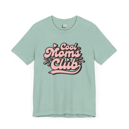 Dusty Blue mom t-shirt that says cool moms club in pink and black retro font.