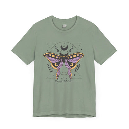 sage green t-shirt that says basic witch with a butterfly witch symbol design