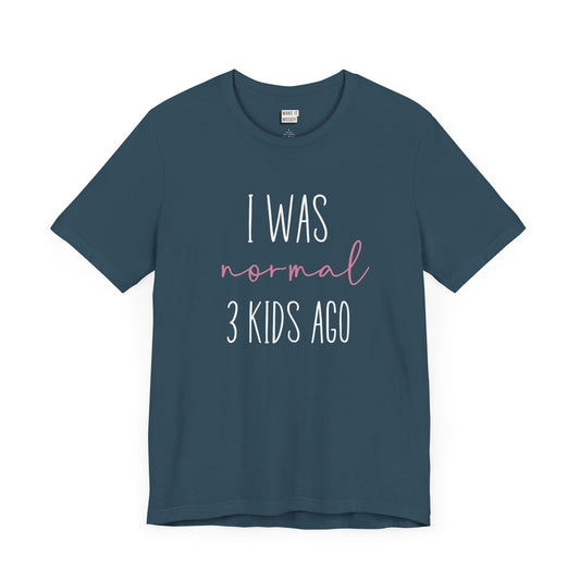 Dark Teal Mom t-shirt with the text I Was Normal 3 Kids Ago printed in white and pink.