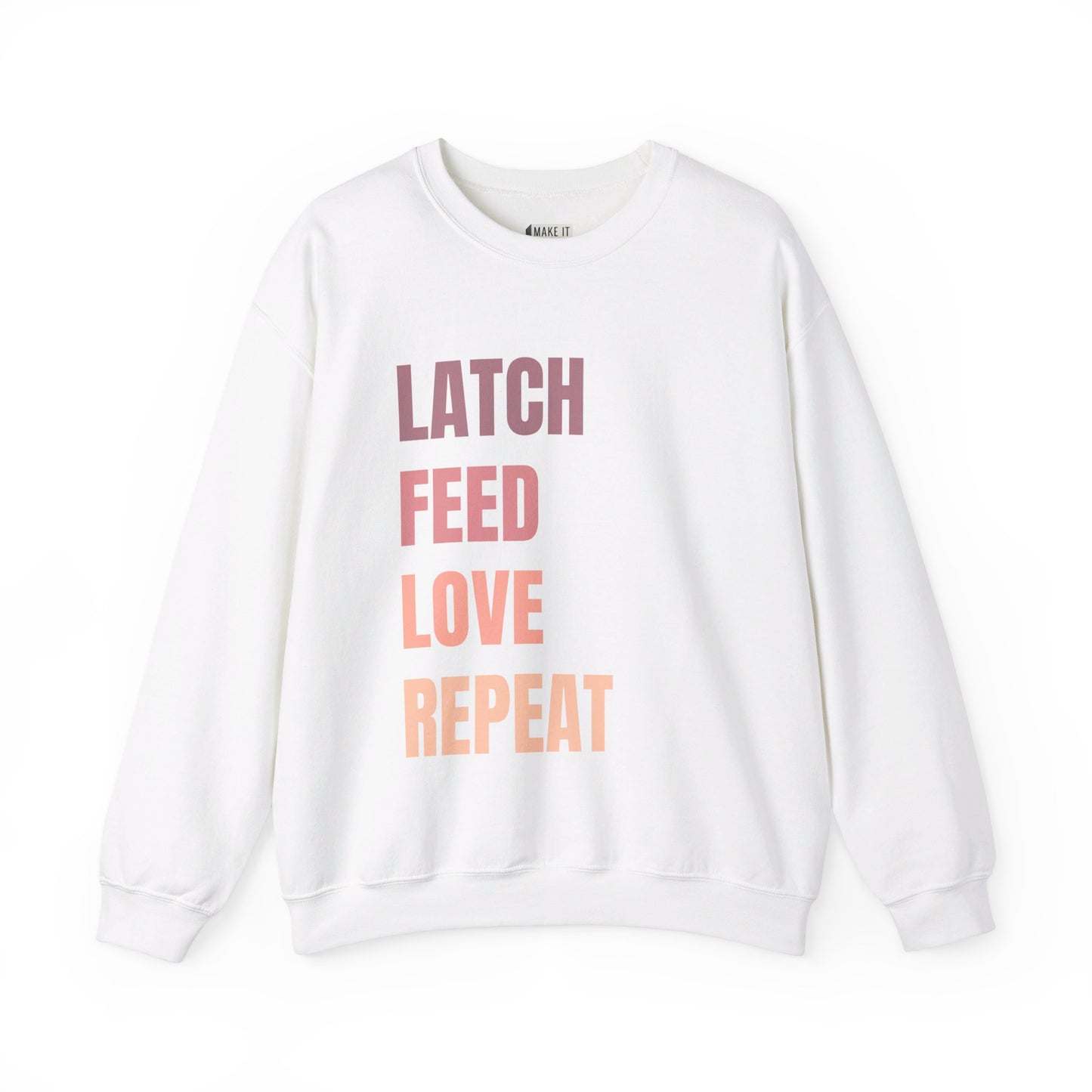 White breastfeeding sweatshirt that says LATCH FEED LOVE REPEAT in bold pink gradient font.