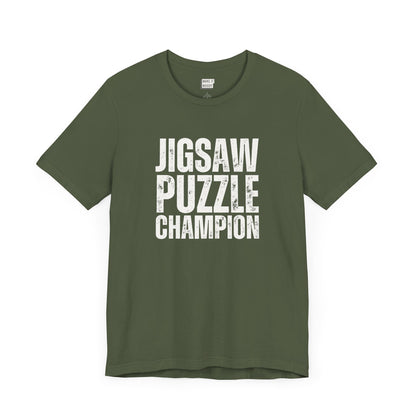 funny graphic t shirt in dark green that says JIGSAW PUZZLE CHAMPION in bold white lettering