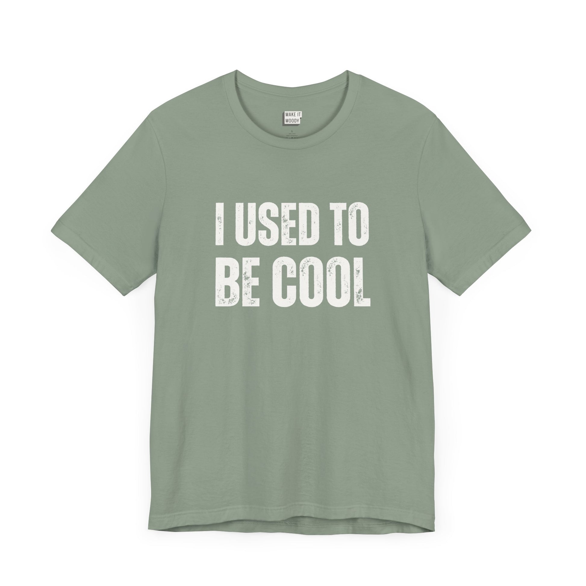 funny t shirt in sage green that says I USED TO BE COOL in bold white lettering