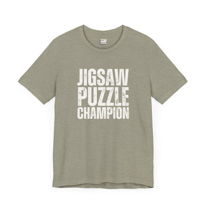 funny graphic t shirt in stone that says JIGSAW PUZZLE CHAMPION in bold white lettering