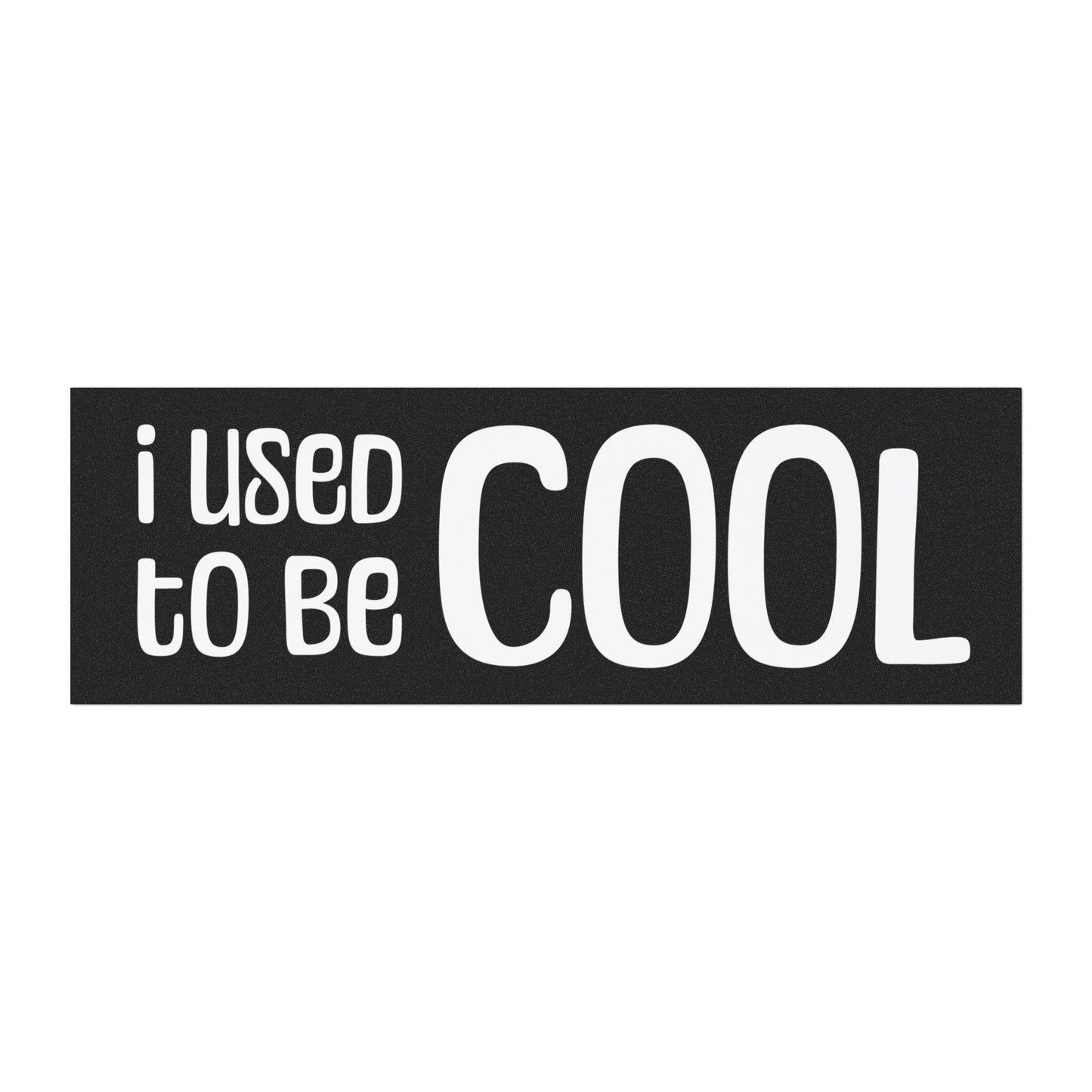 A black rectangular car magnet with white text that reads "I Used To Be Cool" in playful fonts.