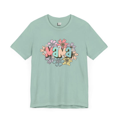 Dusty blue mom t-shirt adorned with the word Mama in colorful letters, surrounded by pastel flowers.