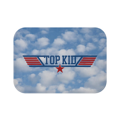 Cloud background with "TOP KID" text in blue, a red star in the center, and blue and red wings on either side, featured on the "Top Kid" Aviation-Themed Bath Mat.