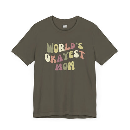 Army green mom t-shirt with colorful, playful text that reads WORLD'S OKAYEST MOM.