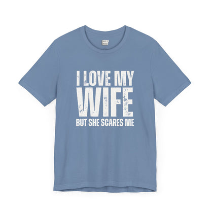 funny t shirt in light blue that says I LOVE MY WIFE BUT SHE SCARES ME in bold white lettering