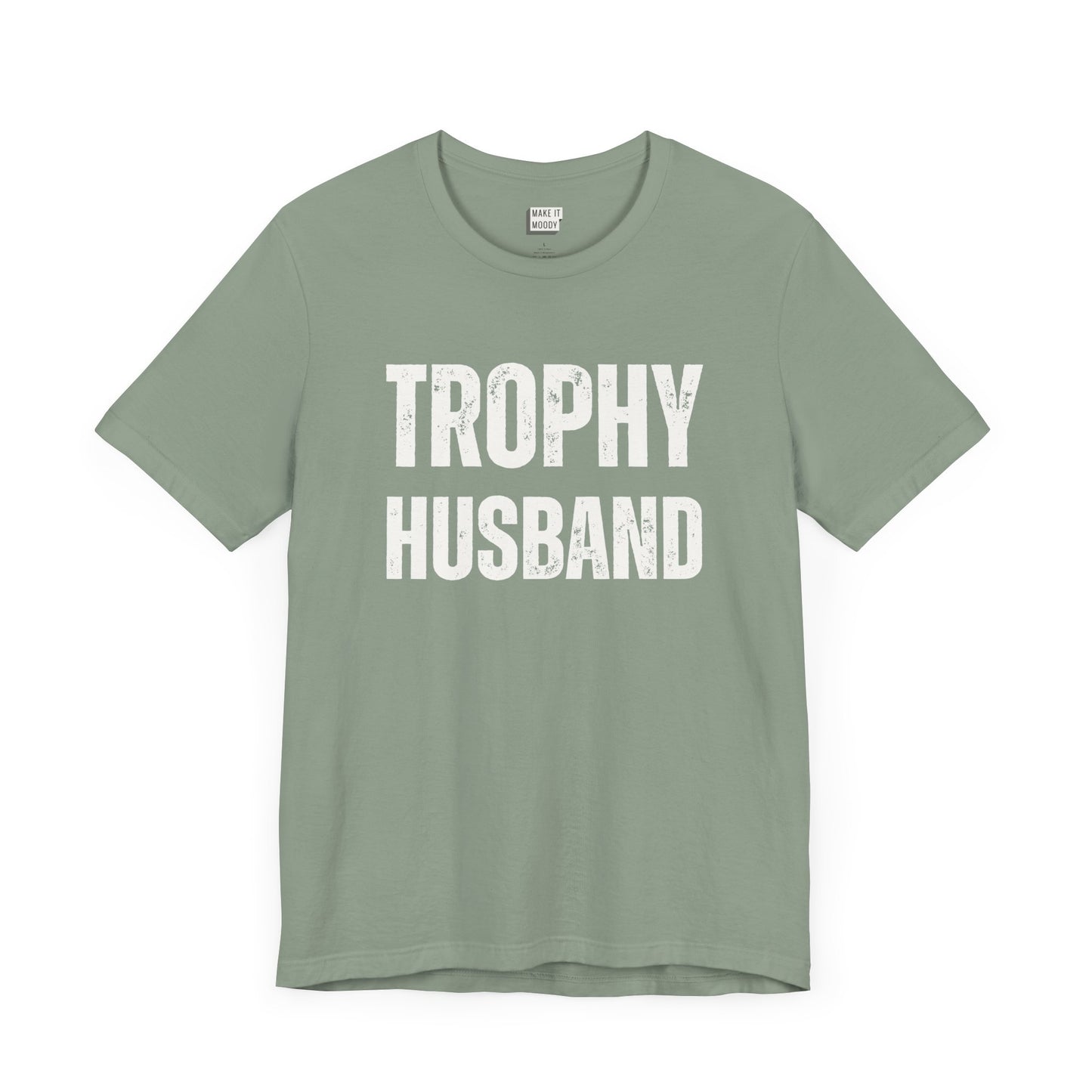 funny t shirt for men in sage green that says TROPHY HUSBAND in bold white lettering