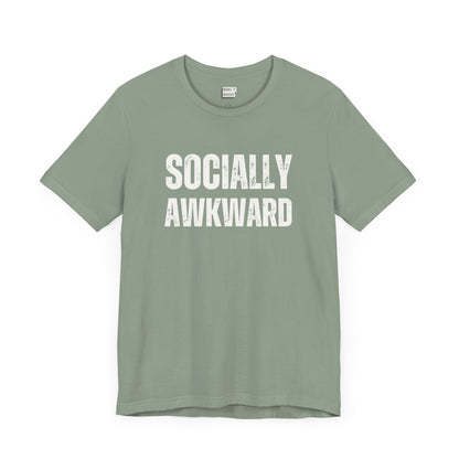 funny t shirt in the color sage green that says SOCIALLY AWKWARD in bold white lettering