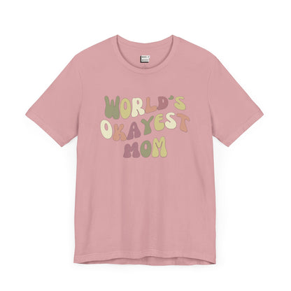 Orchid pink mom t-shirt with colorful, playful text that reads WORLD'S OKAYEST MOM.