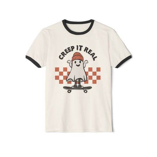 Natural/black unisex cotton ringer Halloween t-shirt, featuring a ghost on a skateboard with the text "Creep It Real" above and a checkered red background design.