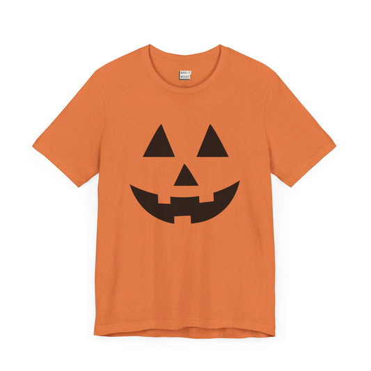 orange halloween t-shirt with a smiling jack-o-lantern face on the front and an evil jack-o-lantern face on the back