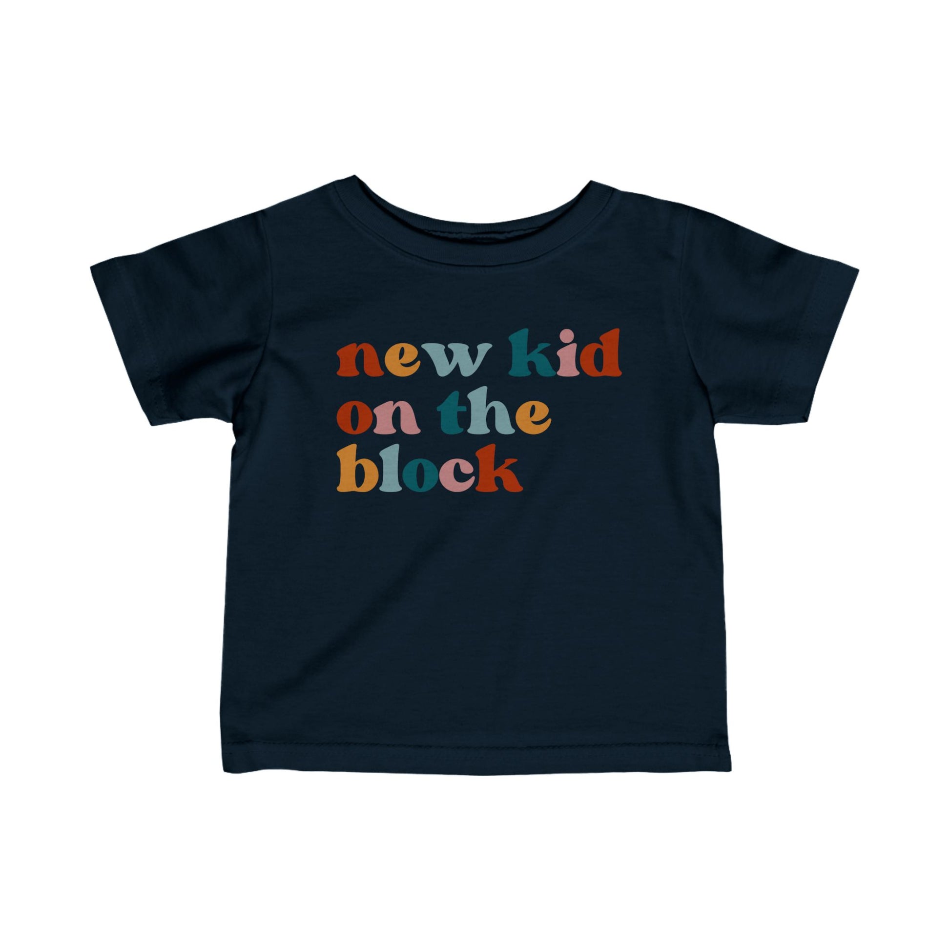 Navy colored t-shirt for babies that says NEW KID ON THE BLOCK in multicolor lettering on the front.