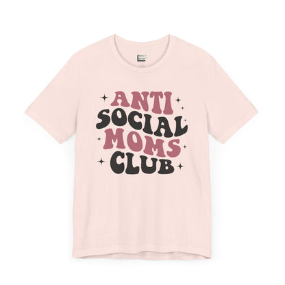 Soft pink funny mom tee that says antisocial moms club in bold retro font.