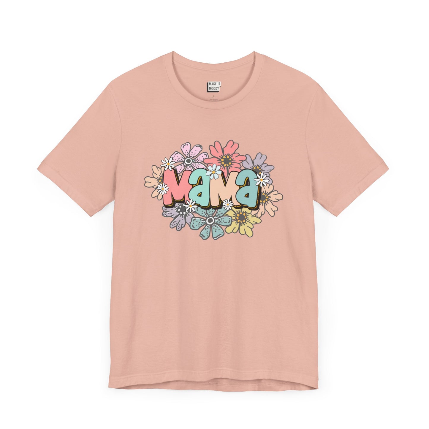 Peach colored mom t-shirt adorned with the word Mama in colorful letters, surrounded by pastel flowers.