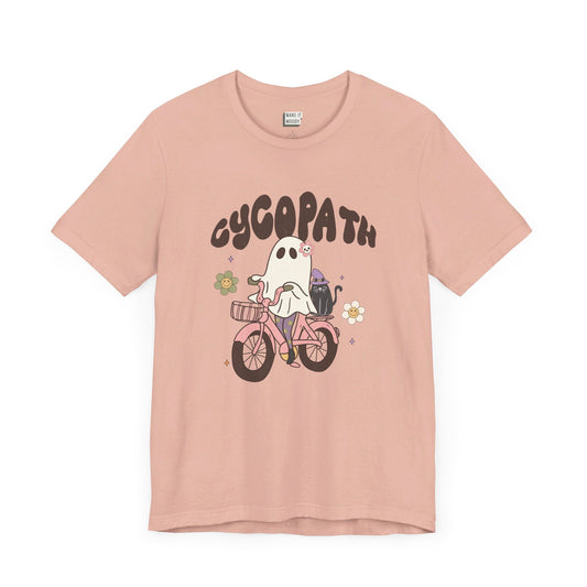 retro style t-shirt with a graphic of a cute ghost riding a bicycle with the lettering cycopath at the top