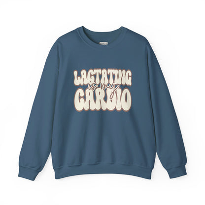 Denim blue colored funny breastfeeding sweatshirt that says LACTATING IS MY CARDIO in retro lettering.