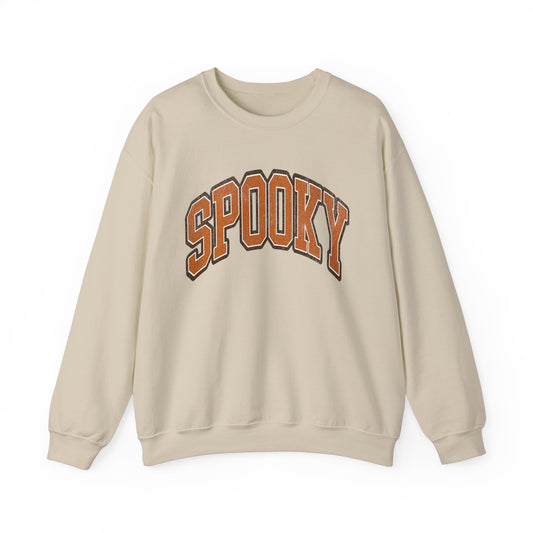 Sand colored Halloween crewneck sweatshirt featuring the word SPOOKY in arched, bold orange and black letters on the front.