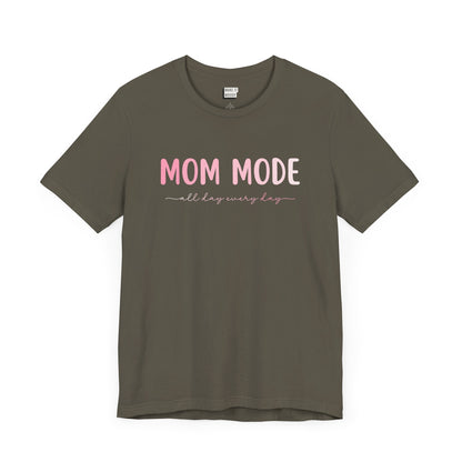 Army green-colored mom t-shirt with the text MOM MODE all day every day in pink and white font.