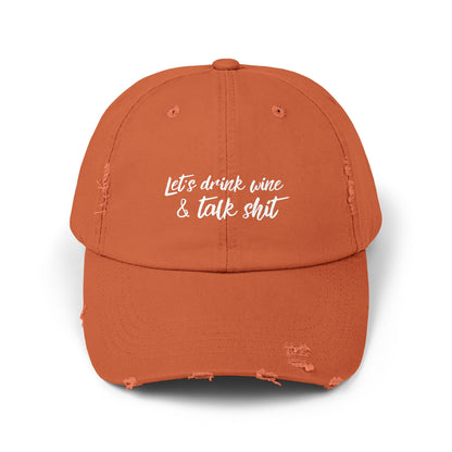 Orange drinking hat that says LET'S DRINK WINE & TALK SHIT on the front in white script lettering.