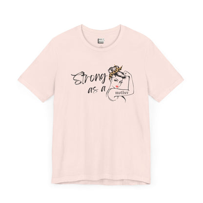 Soft pink mom t-shirt with the words, Strong as a mother printed on the front.