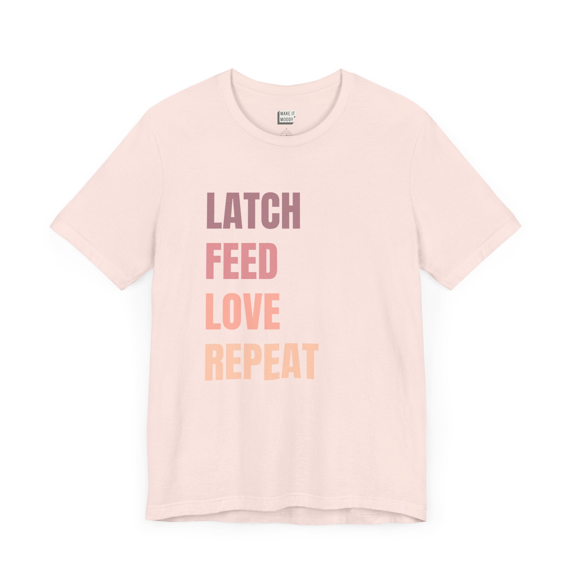 Soft pink breastfeeding t-shirt with the words LATCH FEED LOVE REPEAT in bold pink gradient text.