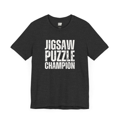 funny graphic t shirt in dark grey that says JIGSAW PUZZLE CHAMPION in bold white lettering