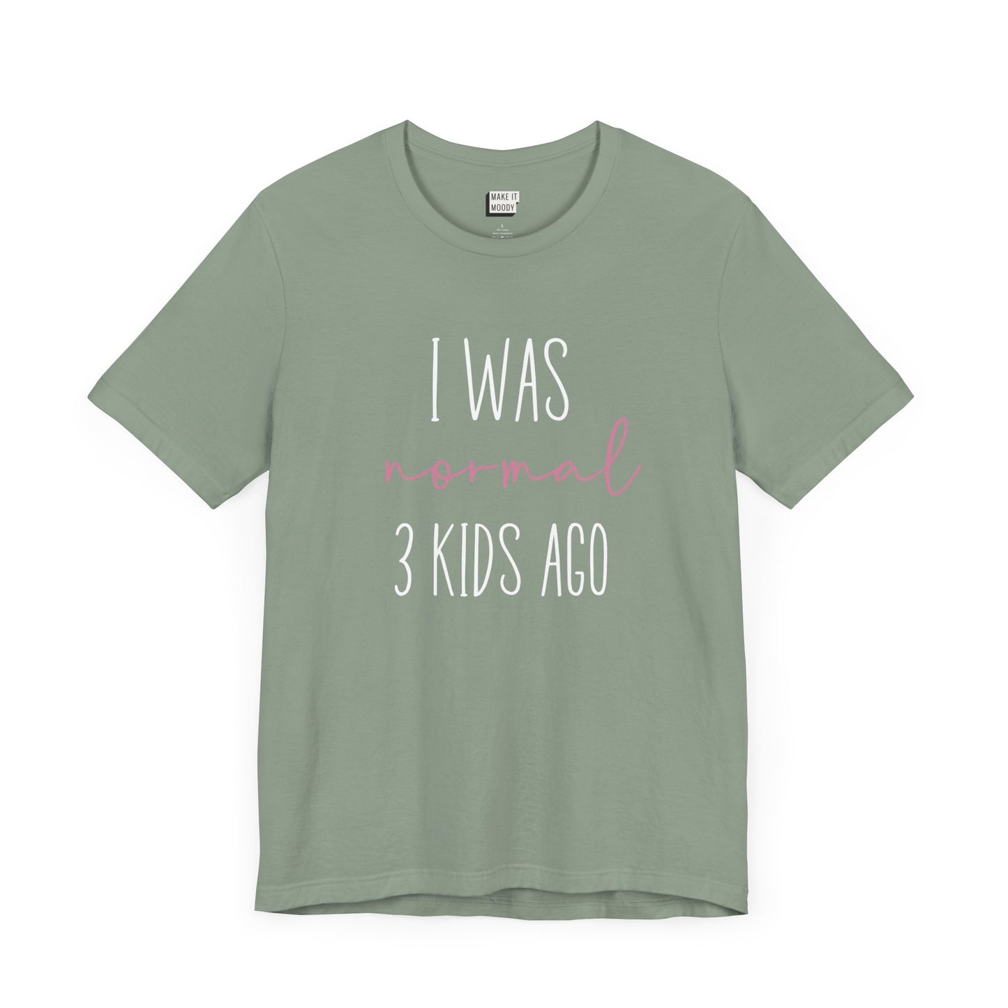 Sage green Mom t-shirt with the text I Was Normal 3 Kids Ago printed in white and pink.