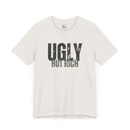 funny t shirt in white that says UGLY BUT RICH in dark bold lettering