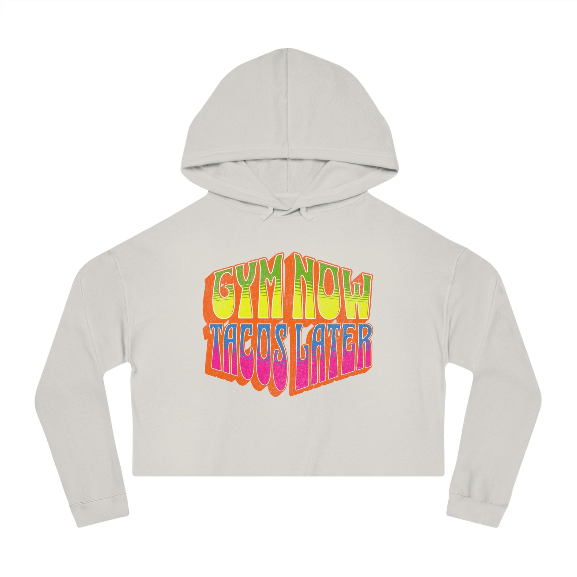 Off-white cropped women's gym hoodie that says GYM NOW, TACOS LATER in bold multicolor lettering.