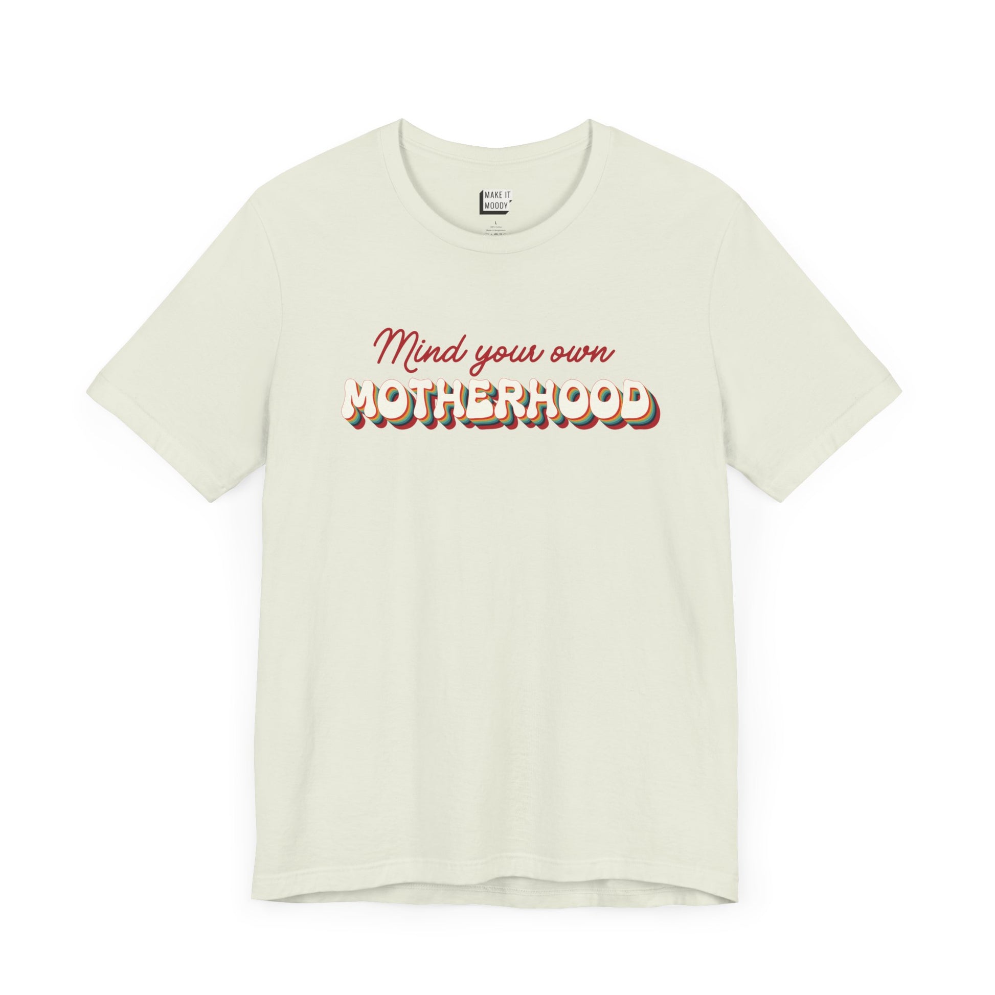 Light green mom t-shirt featuring the text Mind your own MOTHERHOOD in red and rainbow colored 3D-style retro letters.