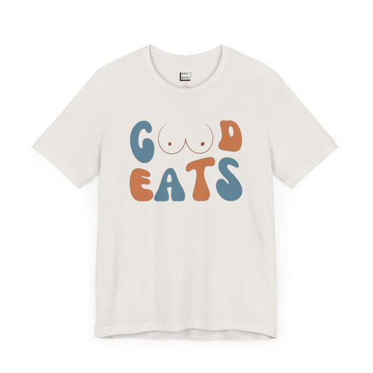 funny retro-style breastfeeding mom t-shirt in the color vintage white that says GOOD EATS on the front with a minimalistic breast graphic in place of the double O in the word GOOD.