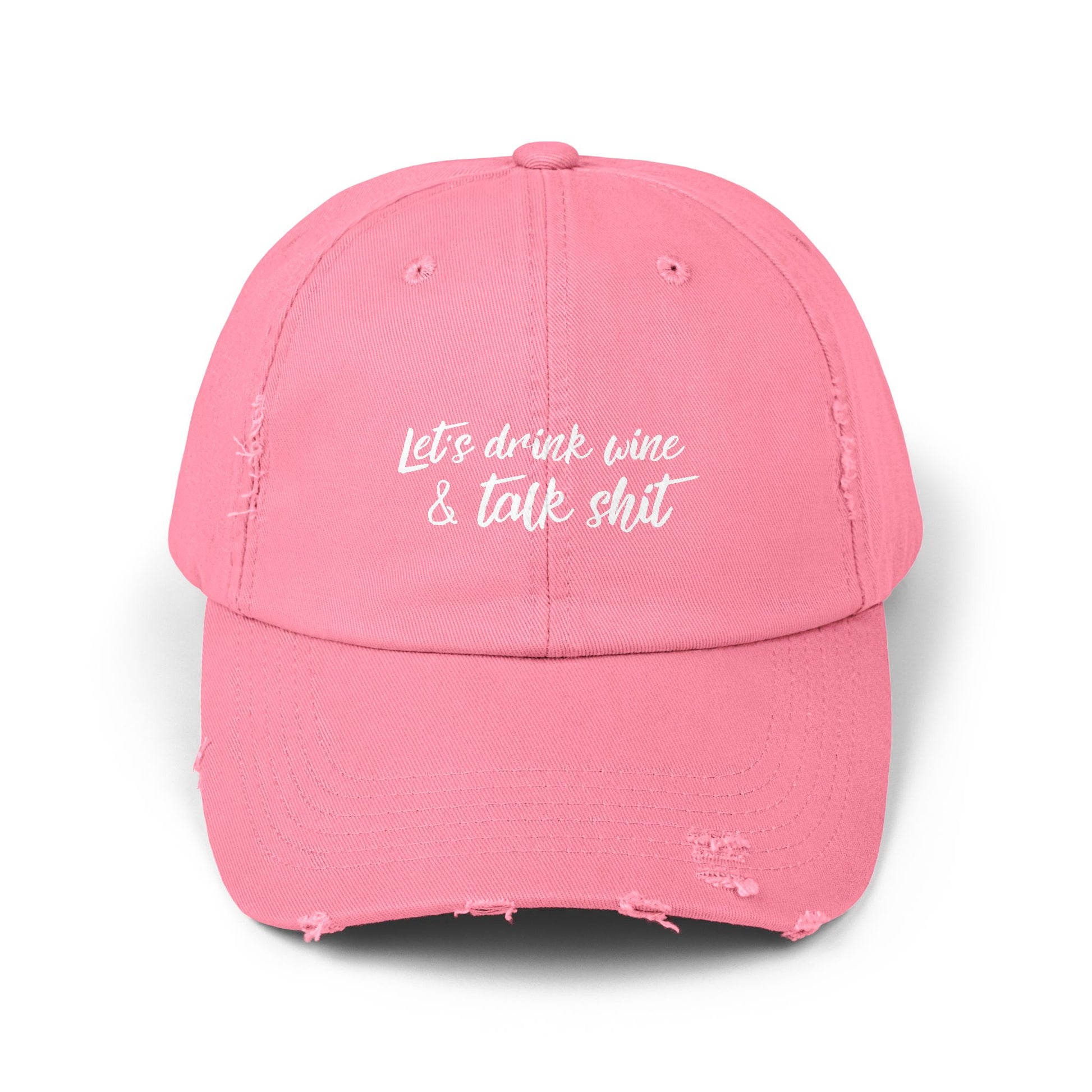 Pink drinking hat that says LET'S DRINK WINE & TALK SHIT on the front in white script lettering.